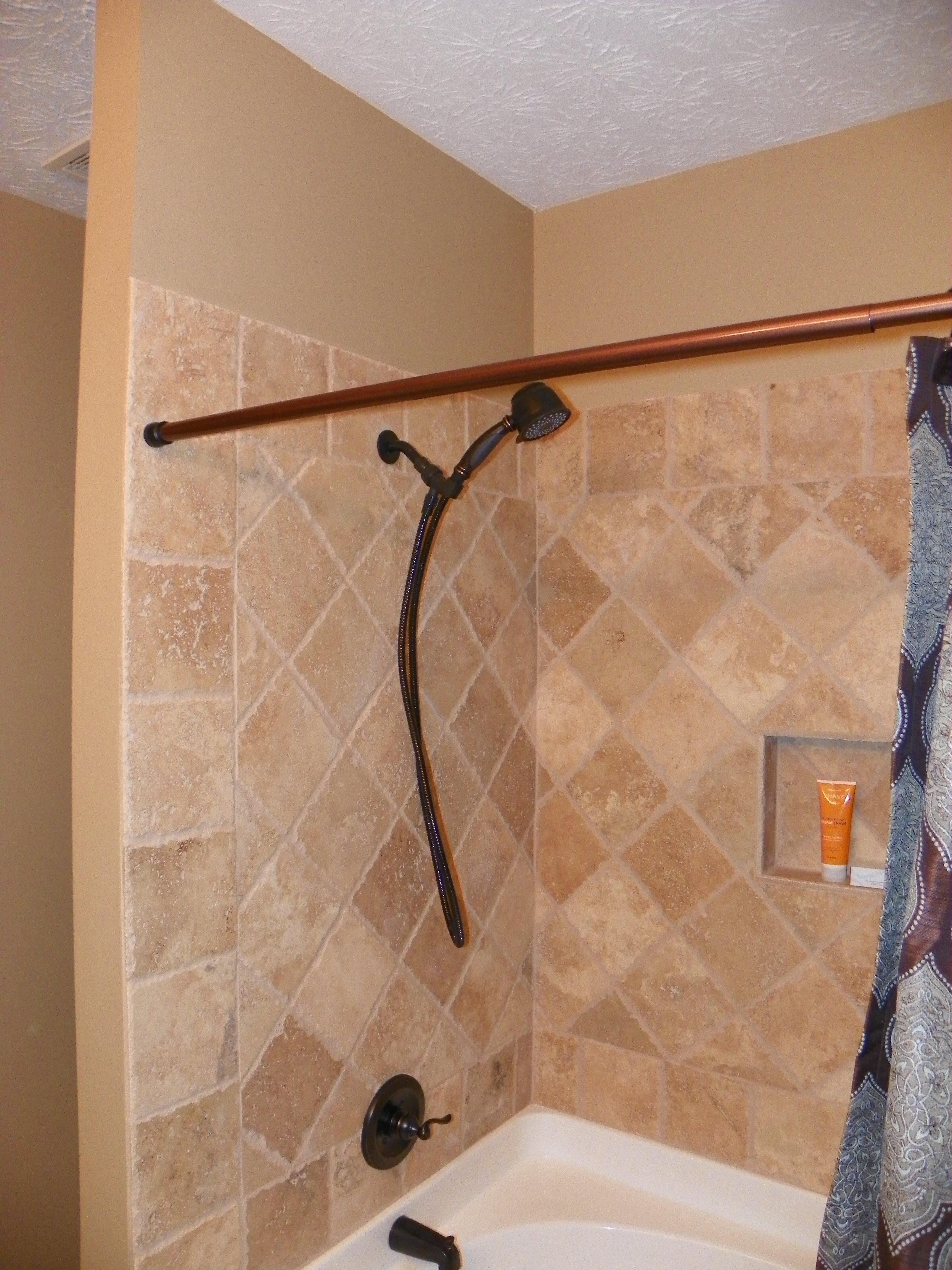 Bathroom renovation with gorgeous tile and ORB fixtures.