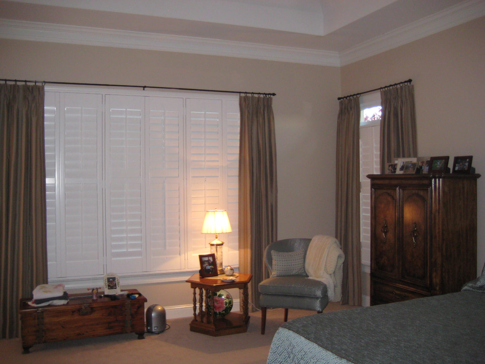 Bedroom Make over. Window treatment and shutters help insulate the home for the winter and summer.