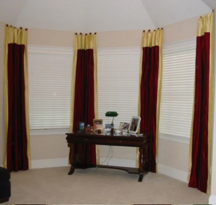 Bedroom - Silk Panels hung on swagholders to match bedding.