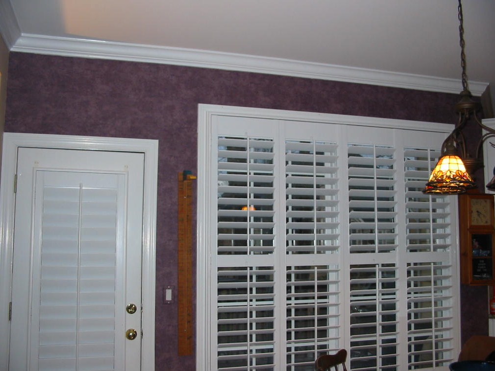 Before Kitchen Window Treatments and shutters were installed.