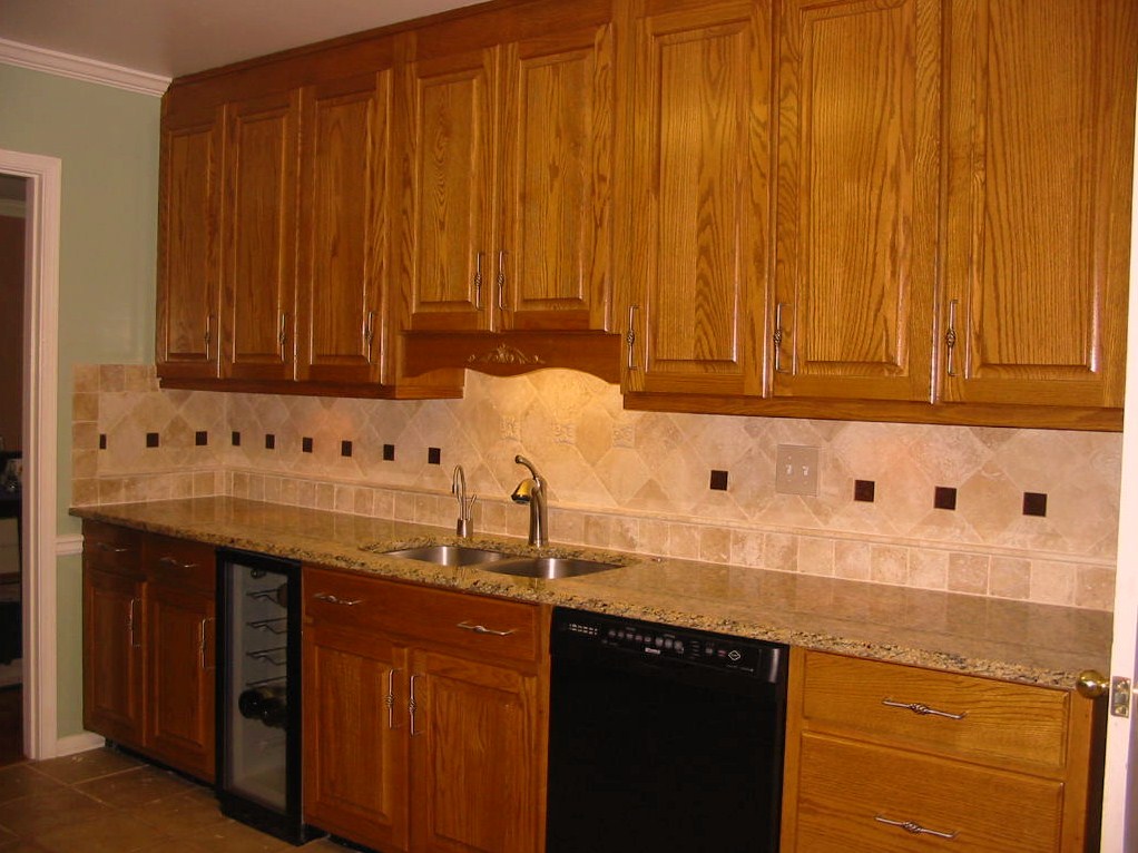 Kitchen - Renovation - Tile backsplash, cabinets, granite.