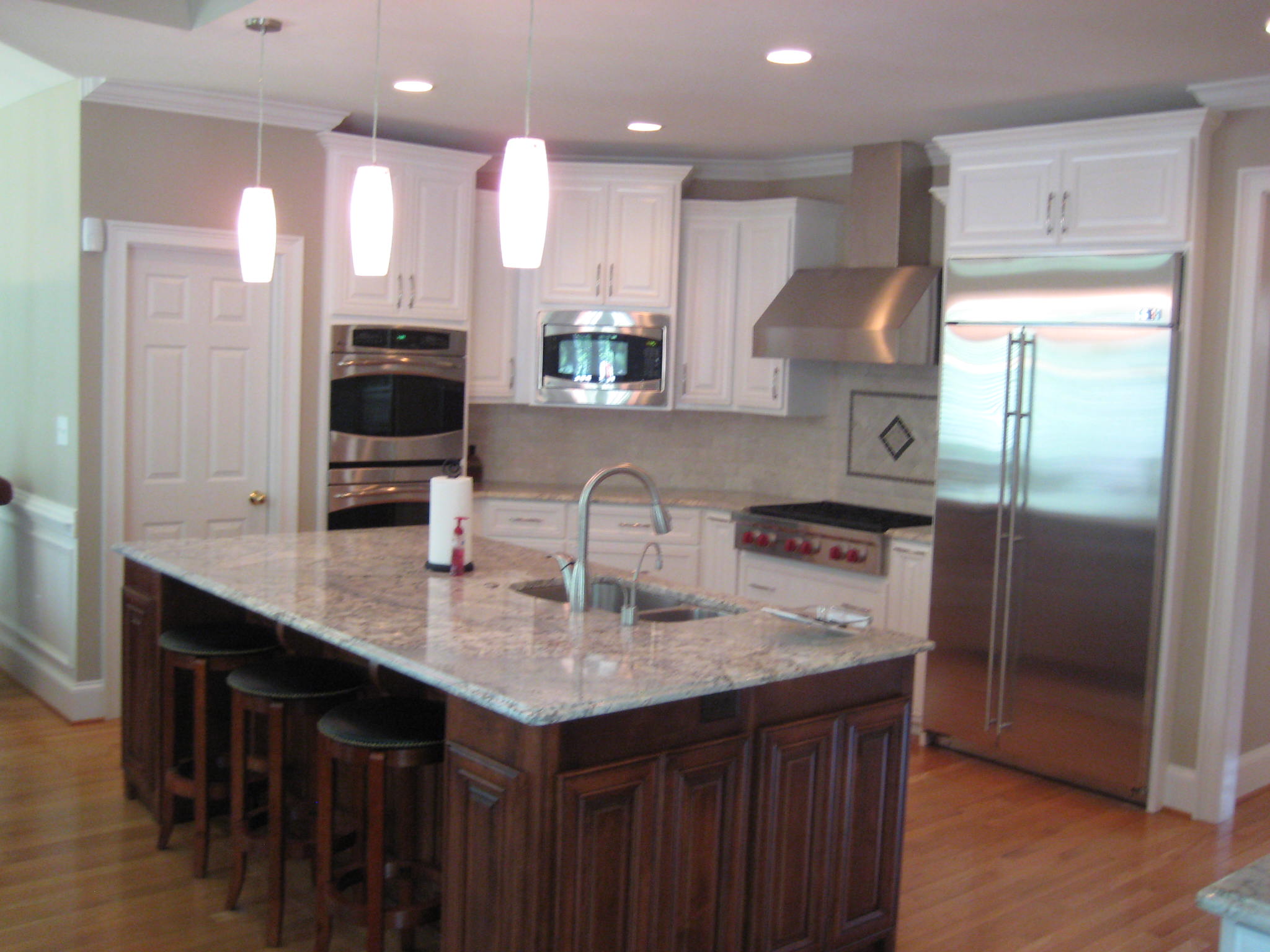 Kitchen renovation with appliances, granite and more.