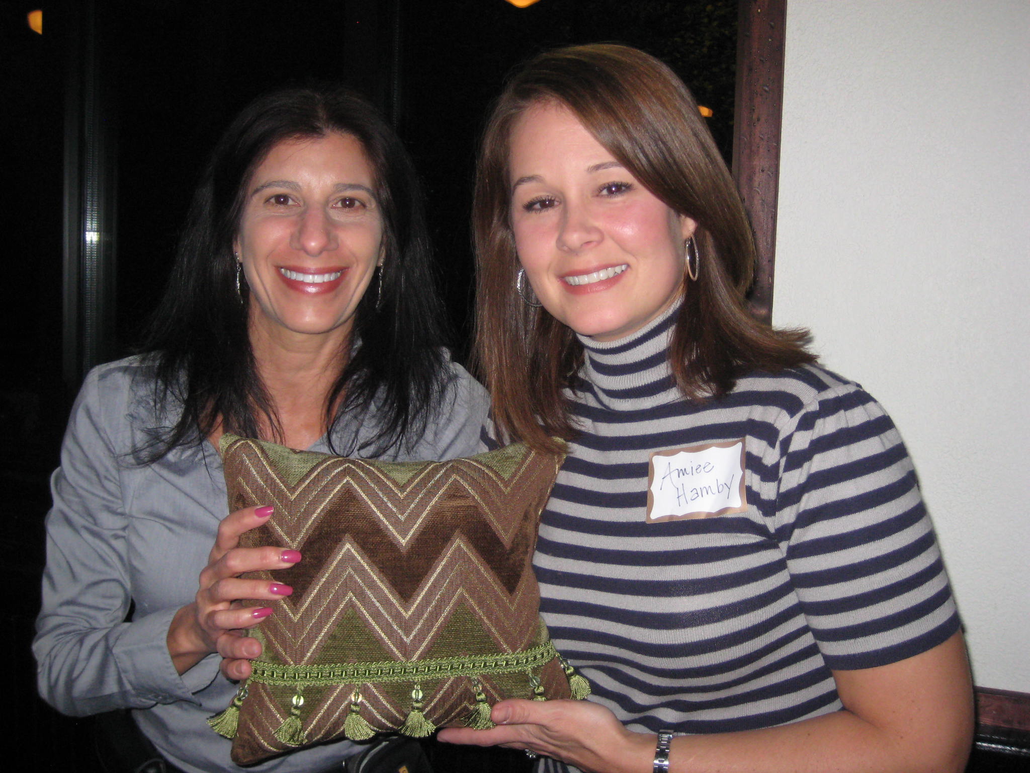 Julia Virga with WWC door prize donation winner to help her accessorize her home.