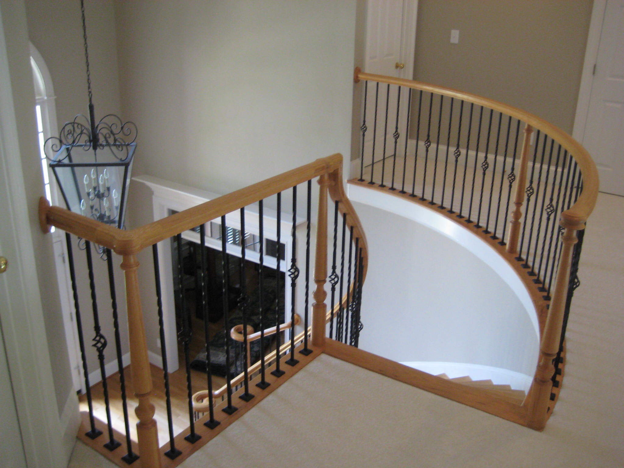Iron Balusters enhances elegant staircase.
