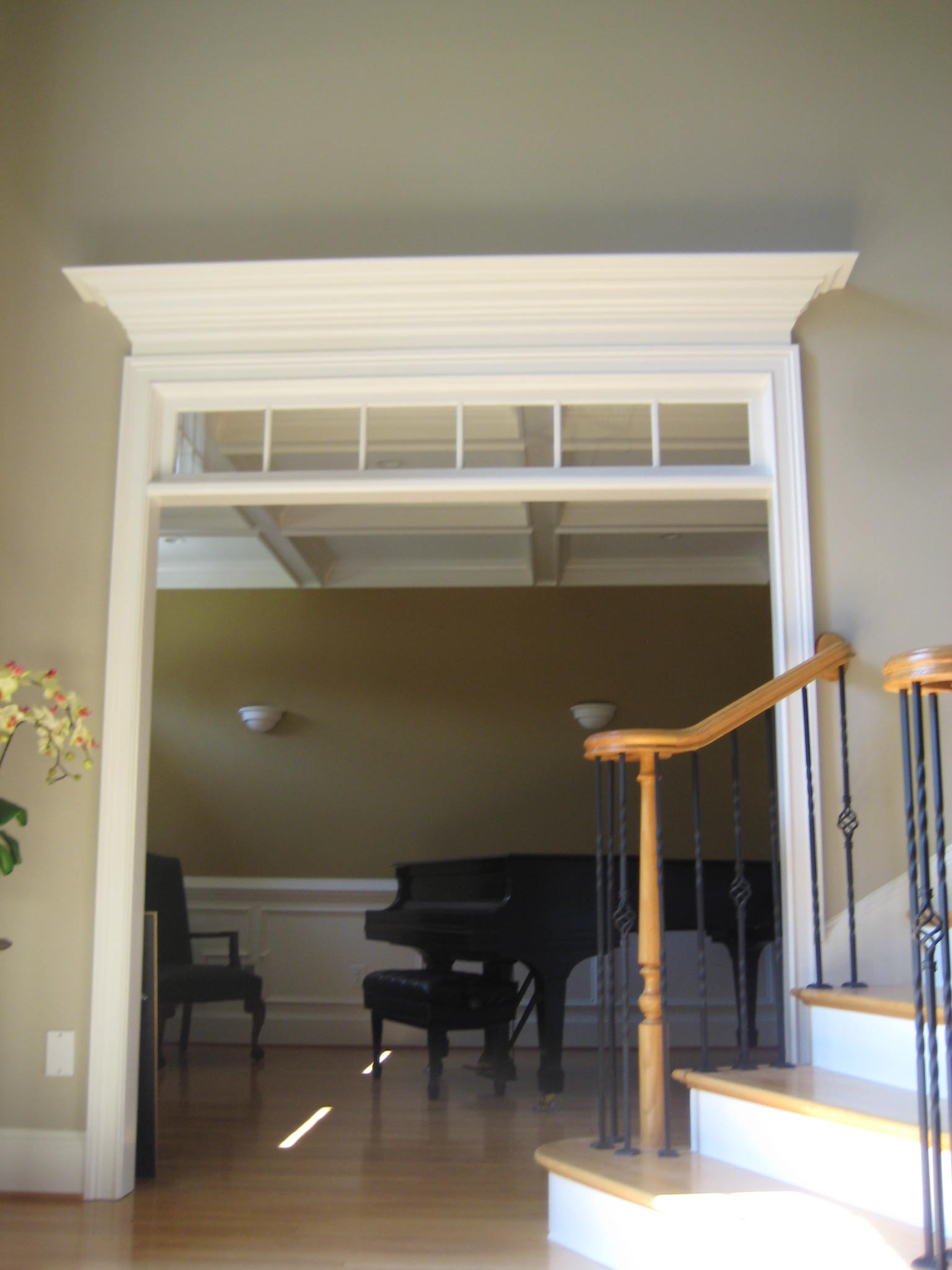 Remodeling Living Room by removing doors and adding top trim molding and more.