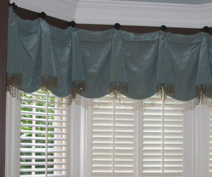 Living Room - Window Treatment hung on beautiful Swagholders w/beads