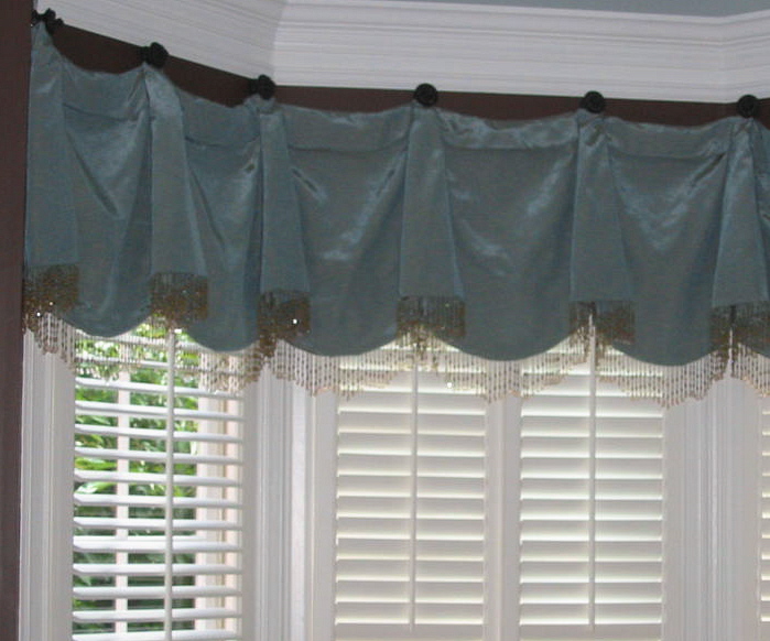 Living Room - Window Treatment hung on beautiful Swagholders w/beads